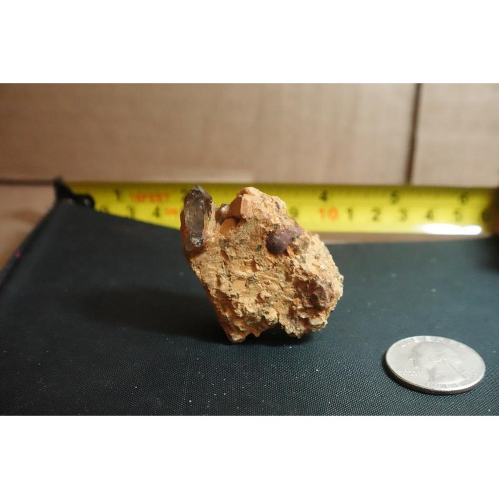 Smoky Quartz crystal on feldspar pegmatite